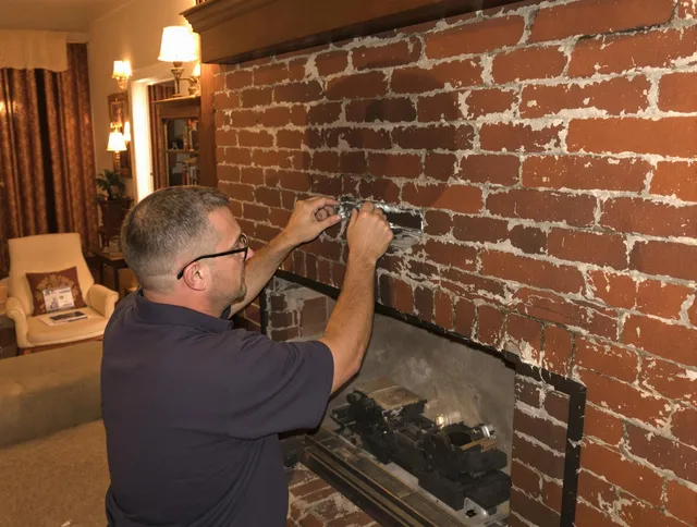 Northbridge Chimney Sweep expert fixing a fireplace in Northbridge, MA